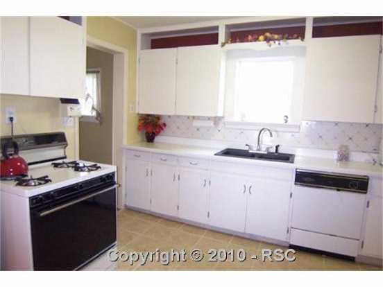 2140 Slocum Road Peyton, CO 80831 - Photo 2 of 16 You'll love this country kitchen with included appliances, newer sink, lots of cabinetry and tiled flooring overlooking the front yard!