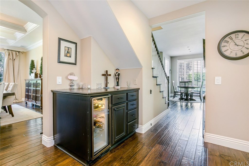 46 Rolling Ridge Rancho Santa Margarita, CA 92688 - Photo 9 of 26 Tucked under the rear staircase, is a bar with U-Line wine fridge. A Wine "cellar" closet is directly adjacent.