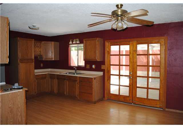 11837 Waterhill Road Lakeside, CA 92040 - Photo 11 of 18 French doors off kitchen to covered patio.