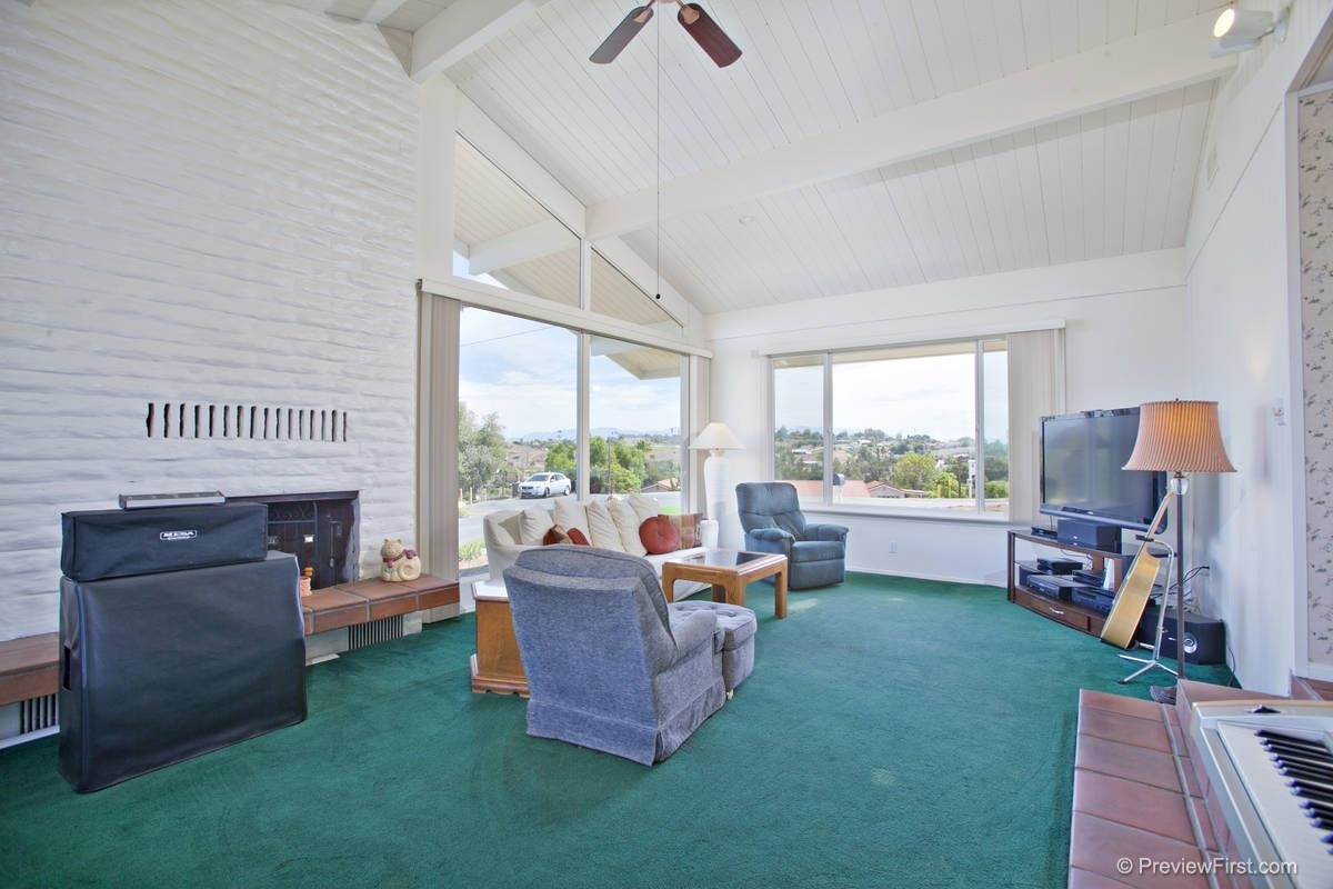 4933 Conejo Road Fallbrook, CA 92028 - Photo 11 of 25 Another photo of the Great Room. Note the vaulted ceiling & the floor to ceiling brick fireplace. There are views facing the front of the homes in addition to those to the rear & side