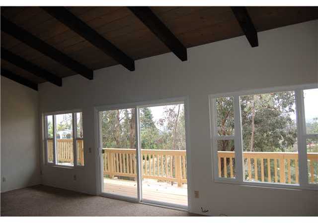2317 Aqua Hill Road Fallbrook, CA 92028 - Photo 12 of 25 Living room with sliders out to view deck!
