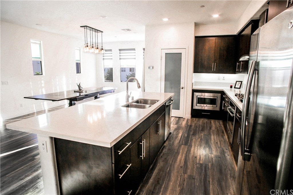 112 Acamar Irvine, CA 92618 - Photo 3 of 14 Coretta Marble Spanning Counters and Large Kitchen Island