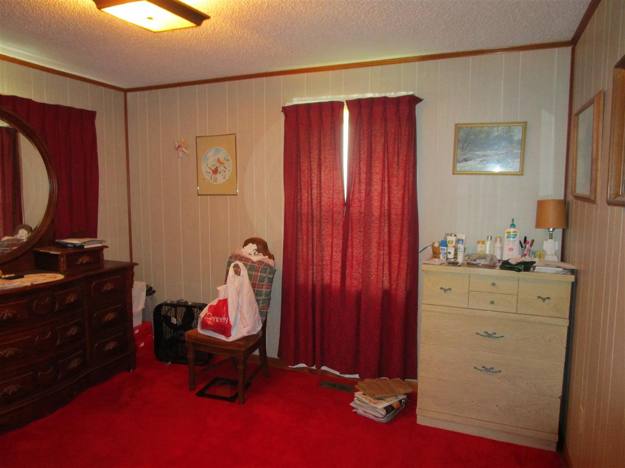 9056 Bass Road Millington, TN 38053 - Photo 15 of 17 Typical bedroom. Master is 18x11 and additional two bedrooms are 12x10 and 11x9. Split bedroom plan with master/master bath on one side of home and two bedroom and bath on other side.