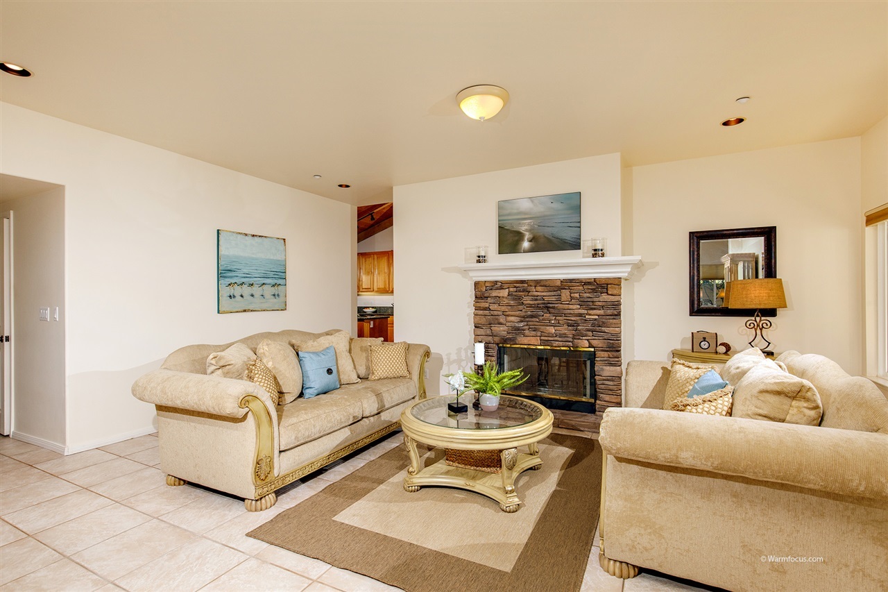 449 Ocean View Avenue Encinitas, CA 92024 - Photo 6 of 23 Double sided fireplace and access to patio in family room