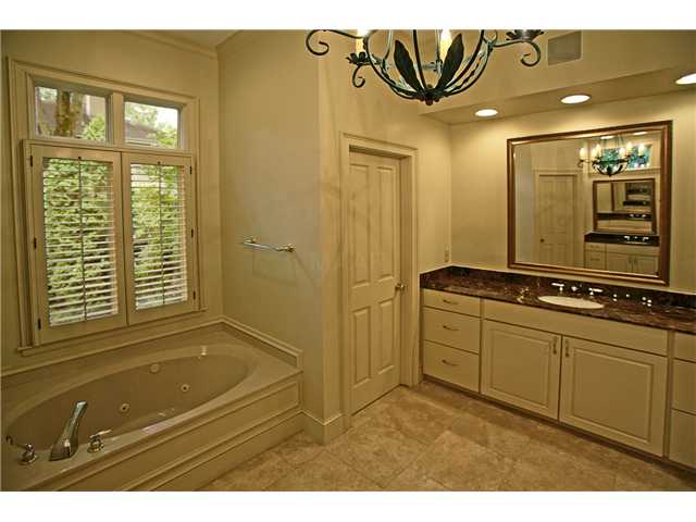 175 Waring Road Memphis, TN 38117 - Photo 10 of 12 Master bath features new his/hers cabinets/marble vanities and two large walk-in closets.