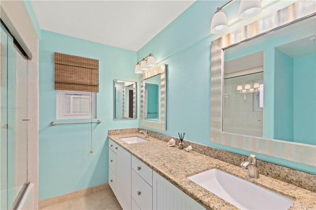 16 Flores Lake Forest, CA 92610 - Photo 23 of 24 Stunning upstairs hall bath, with double sinks, and designer mirrors.