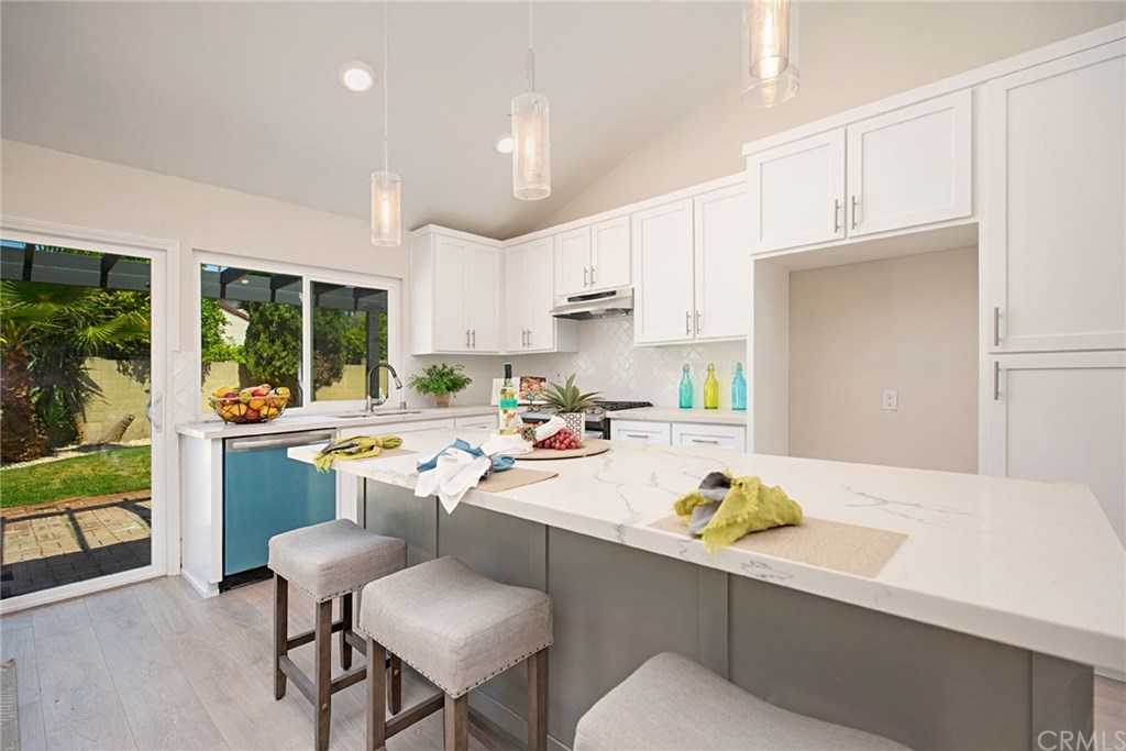 1745 North Bates Circle Anaheim, CA 92806 - Photo 9 of 32 Large kitchen island with modern pendant lighting
