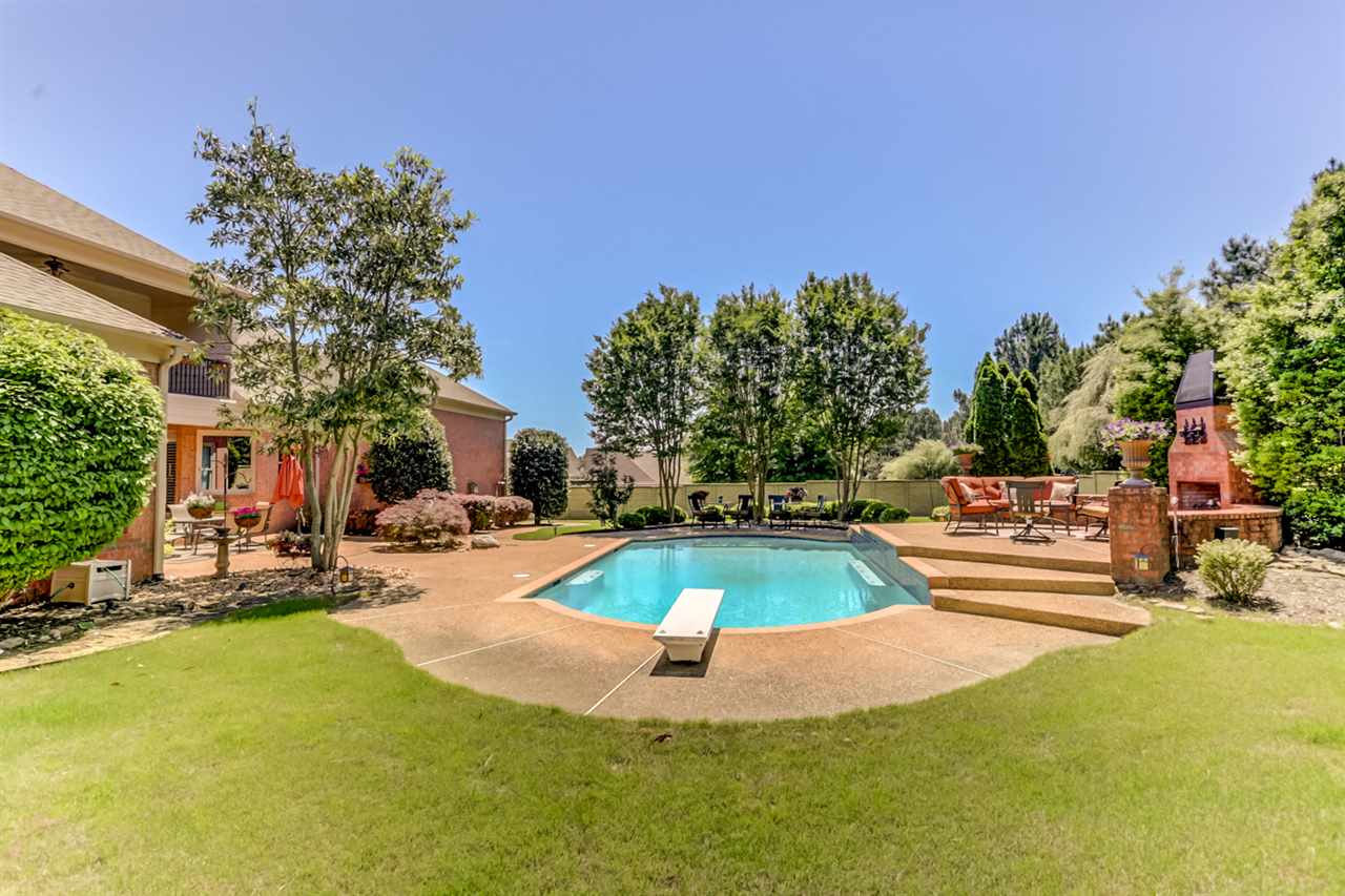 1071 Fall Springs Road Collierville, TN 38017 - Photo 22 of 25 Take a dip and cool off in the beautiful in-ground pool! This backyard is perfect for entertaining!