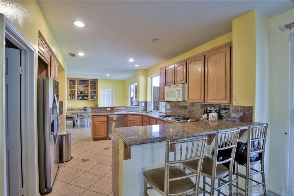 17250 Scottsdale Road Riverside, CA 92504 - Photo 9 of 25 Walk-in Pantry and SS appliances