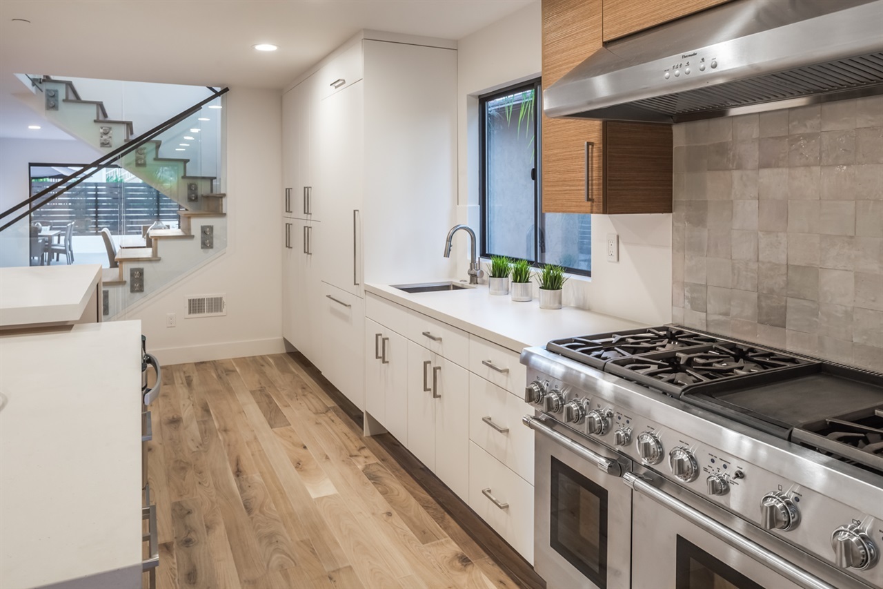 244 Pacific Avenue Solana Beach, CA 92075 - Photo 6 of 20 Designer inspired kitchen details - prep sink and main sink well positioned. Panel fridge and dishwasher with trash enclosure and spice rack