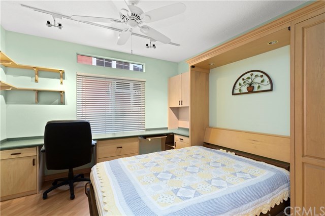 16 Flores Lake Forest, CA 92610 - Photo 14 of 24 Downstairs bedroom has lovely murphy bed and closet to the right.