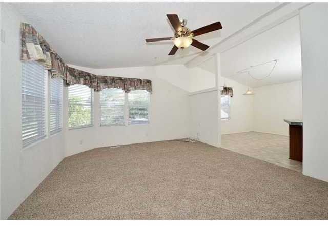 1816 Helix Street Spring Valley, CA 91977 - Photo 3 of 19 Sunny windows and brand new carpet grace the living room!