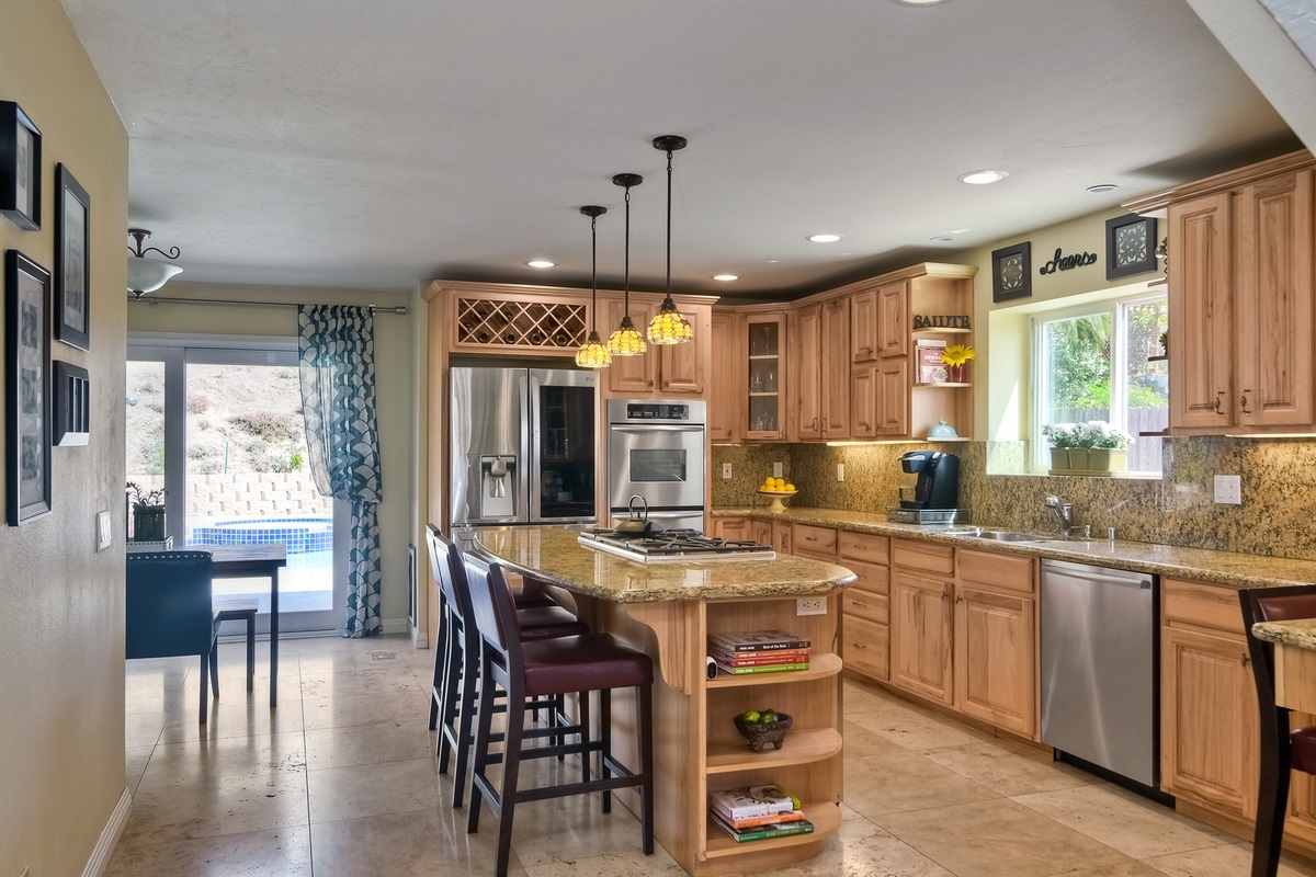 1438 Broken Hitch Road Oceanside, CA 92056 - Photo 5 of 24 Granite, hickory cabinets, stainless appliances, 5 burner cooktop, wine frig. Refrigerator not incl.