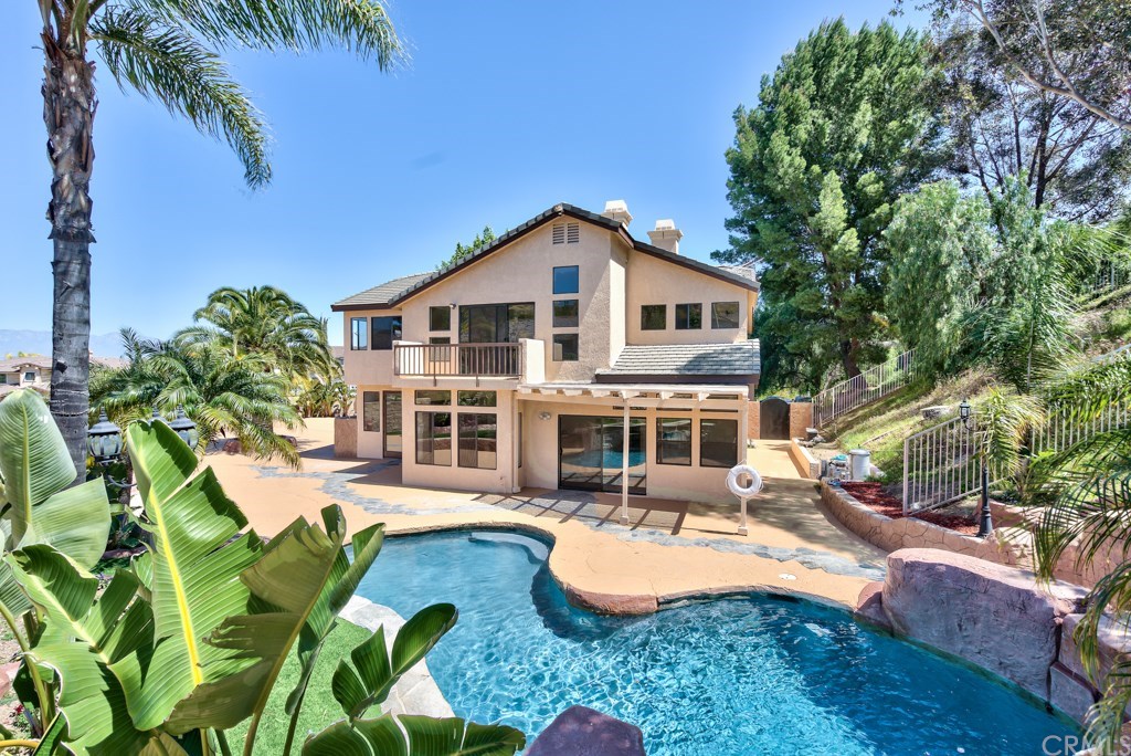 3086 Diamondview Circle Corona, CA 92882 - Photo 3 of 66 Gorgeous tropical landscaping and extended concreted areas for entertainment awaits you in this dream backyard.