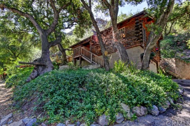 28682 Silverado Canyon Road Silverado, CA 92676 - Photo 1 of 1 Log siding surrounded by mature oaks