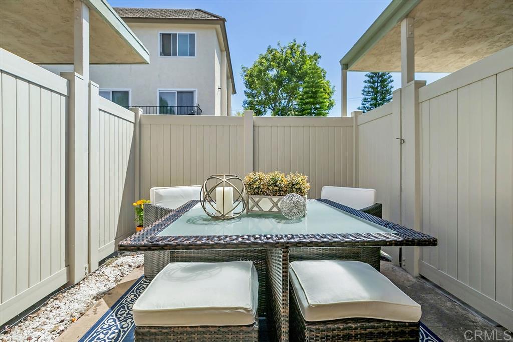 7855 Hummingbird Lane San Diego, CA 92123 - Photo 17 of 25 Enjoy San Diego's beautiful weather all year from one of two patio. The back patio is accessible from the living room and the carport area.