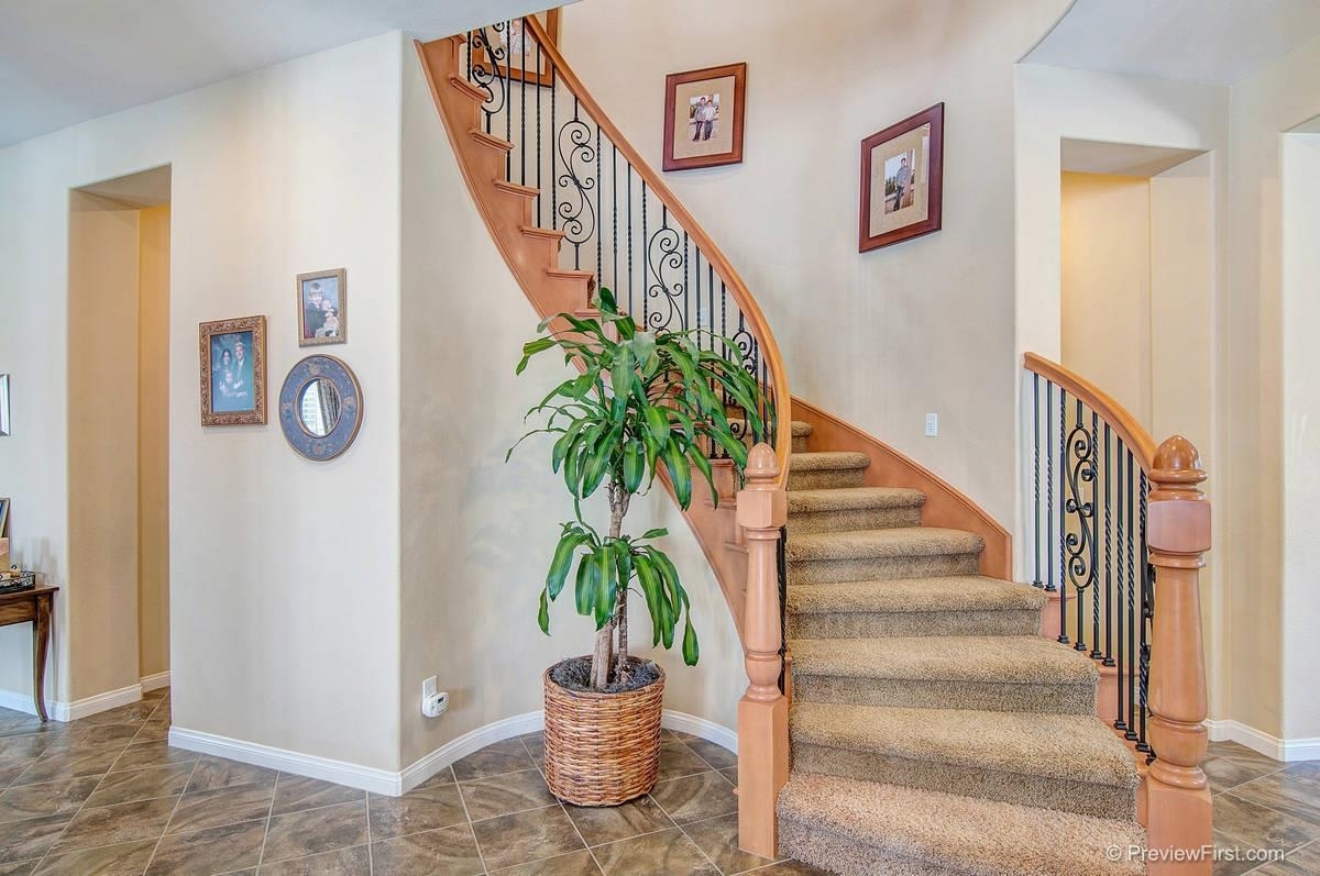16325 Deer Ridge Road San Diego, CA 92127 - Photo 8 of 25 Dramatic Wood and Wrought Iron Spiral Stairway