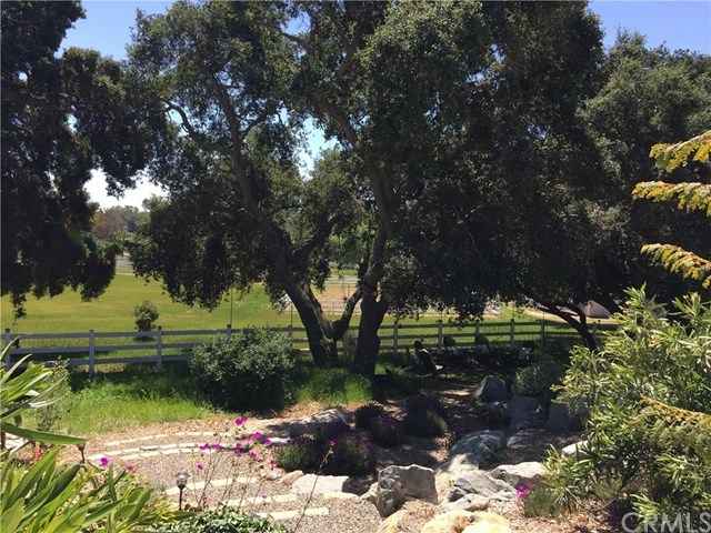 38421 Carrillo Road Fallbrook, CA 92028 - Photo 14 of 57 ENJOY COOL BREEZES UNDER THE OAKS WHILE A WATER FEATURE TUMBLES DOWN BLUE GRANITE ROCKFALL