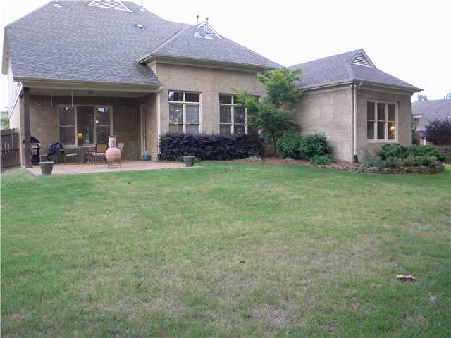 4517 Whisper Spring Drive Collierville, TN 38017 - Photo 11 of 12 Covered Patio, stone Hard scaping , Large enough for a pool ! But you have a Neighborhood pool-so ??