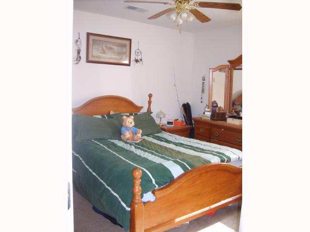 1515 Appleberry Road Atoka, TN 38004 - Photo 8 of 10 They made this their first home, now you can make it yours! Master bedroom with attached bath.