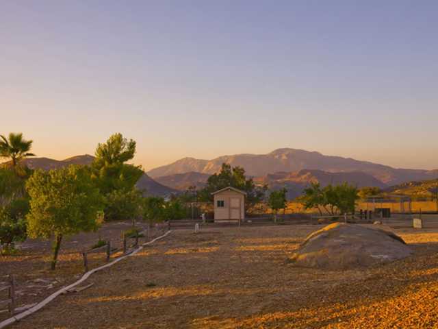1668 La Force Road Alpine, CA 91901 - Photo 20 of 25 Entertainers delight! This backyard features stamped concrete walkways, a pool with slide, waterfall and attached spa, volley ball court, horse shoe area, tether ball area, built-in BBQ area, fire pit, orchard and simply stunning views!