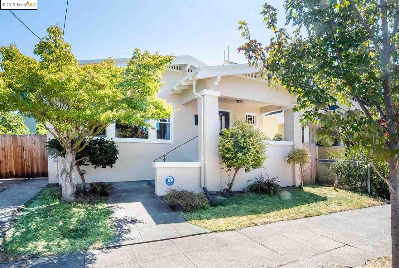 2150 Russell Street Berkeley, CA 94705 - Photo 1 of 1 Showing the driveway gate on the left that allows you to securely park several cars off street.