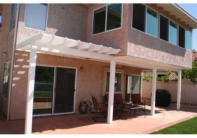 1471 Green Oak Road Vista, CA 92081 - Photo 19 of 19 Back of the house showing bonus room and covered patio area!