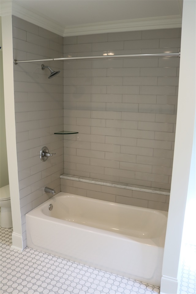 194 Lombardy Road Memphis, TN 38111 - Photo 17 of 25 Another view of this full bathroom with gorgeous gray and white floor tile and fire-clayed gray subway wall tile.