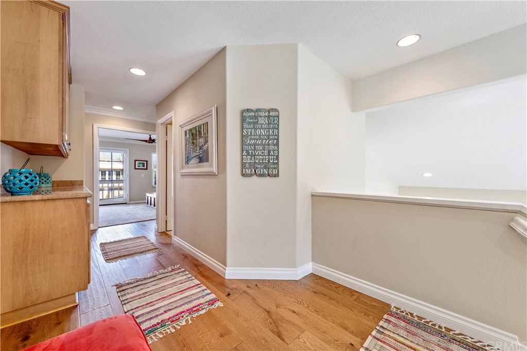 2152 Vallejo Drive Tustin, CA 92782 - Photo 35 of 35 Upstairs hall with beautiful hardwood floors, recessed lighting, storage, neutral paint and lots of natural light.
