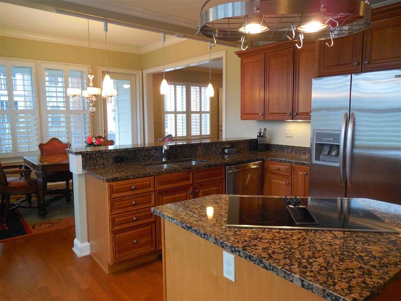 597 Lexington Road, Unit 304 Memphis, TN 38157 - Photo 12 of 23 View from breakfast rm into kitchen and overlooking Granite breakfast bar into Dining room.