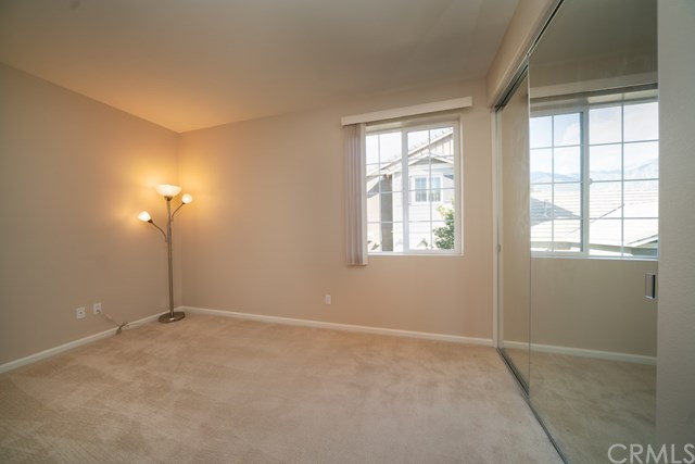 5473 Stoneview Road Rancho Cucamonga, CA 91739 - Photo 23 of 56 Downstairs bedroom with mirrored closet doors