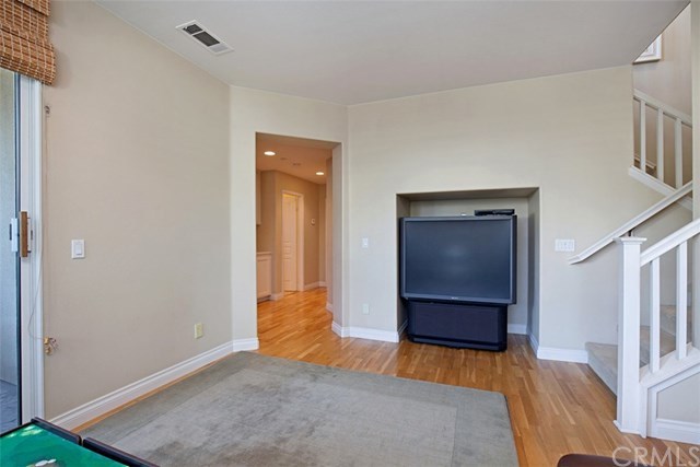 605 Corte Calmo San Clemente, CA 92673 - Photo 21 of 27 Lower level hallway as seen from the family room.