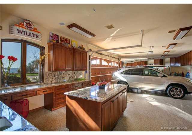 5111 Espinoza Road El Cajon, CA 92021 - Photo 18 of 25 MAIN HOUSES OVER SIZED FOUR CAR GARAGE WITH WOOD CABINETS, GRANITE COUNTERS, SEALED FLOORS, AND DESIGNER PAINT.