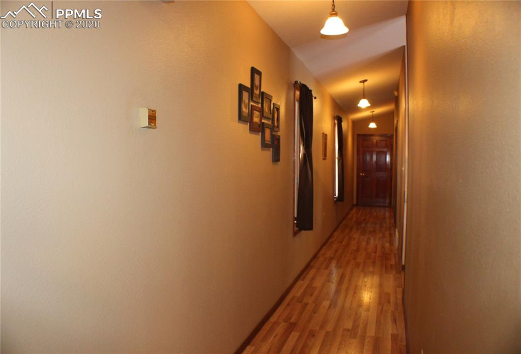 2465 Evergreen Road Colorado Springs, CO 80921 - Photo 9 of 25 Hardwood flooring hallway
