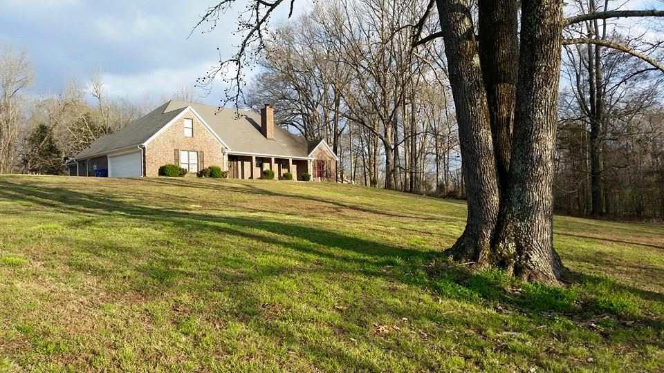 5340 Poplar Corner Road Walls, MS 38680 - Photo 1 of 25 Drive down the driveway and take in the view of the stocked pond and large front yard of this home nestled on 5.01 acres.