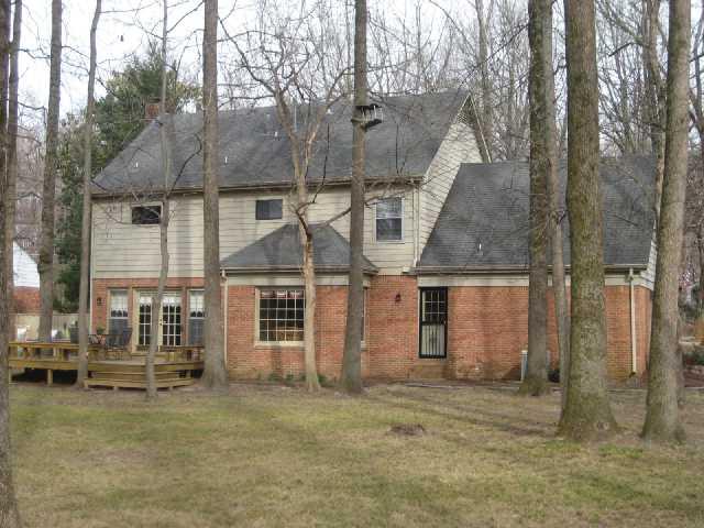 2435 Howard Road Germantown, TN 38138 - Photo 2 of 10 Rear view of this beautiful home in Germantown. This street is tree lined and the back yard is too! Watch the birds frolic in the trees! Very private - you will feel like you are on vacation!