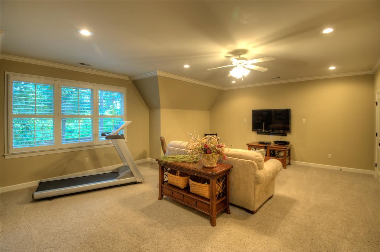 1277 South Dubray Place Collierville, TN 38017 - Photo 15 of 25 Space abounds in this 21x17 room with tons of space for a pool table, entertainment center to enjoy movies, sports or play games. Nine foot smooth ceiling and neutral décor.