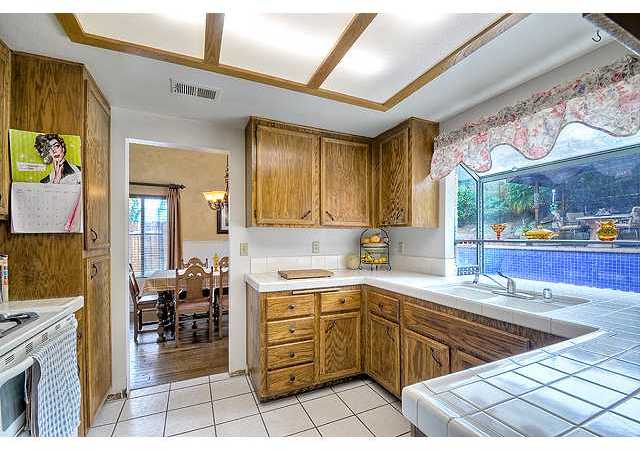 597 Heather Ridge Road San Marcos, CA 92078 - Photo 5 of 16 Swell Kitchen with a view of the pool!!!