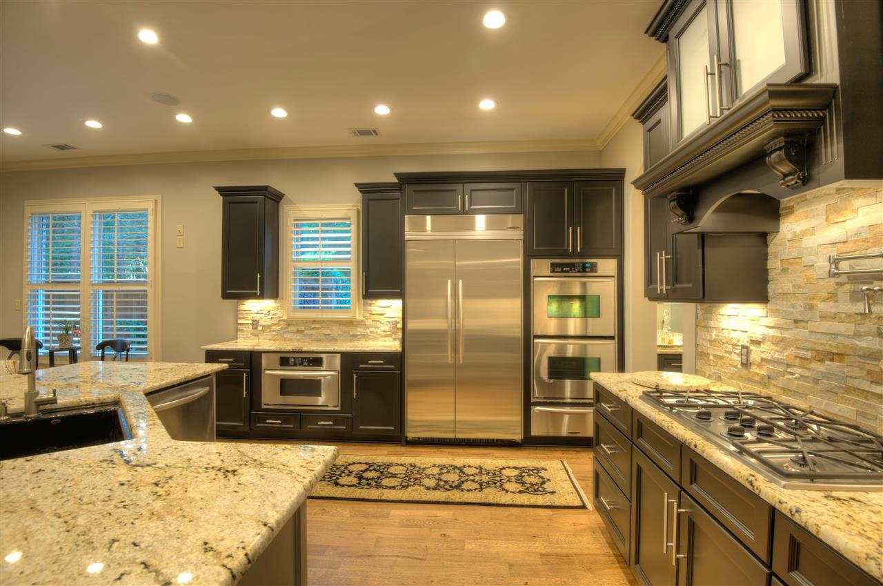 1277 South Dubray Place Collierville, TN 38017 - Photo 7 of 25 Upgraded Gas cook top, custom designed pot filler for oversized cookware, double stainless steel ovens, warming drawer, built in microwave, built in refrigerator and freezer plus a Butler's Pantry are ideal for the growing family