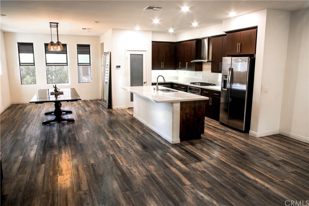 112 Acamar Irvine, CA 92618 - Photo 2 of 14 Upgraded Wood Laminate Flooring and Contemporary Window Treatments, and West Elm Hand Blown Glass Chandelier