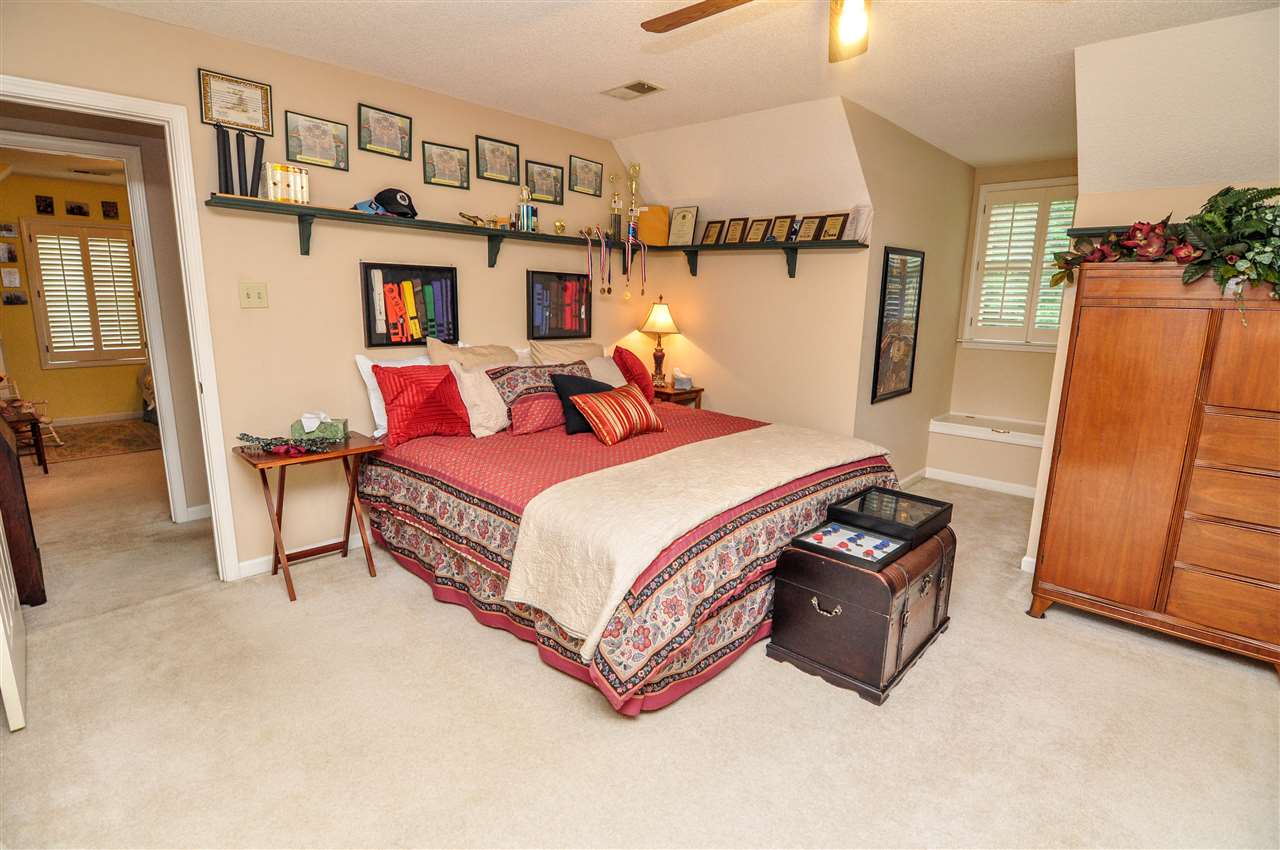 6158 Brunswick Road Lakeland, TN 38002 - Photo 15 of 25 The 3rd bedroom is also upstairs and features carpet, ceiling fan, large closet, window seat, and access to the jack-n-jill bath.