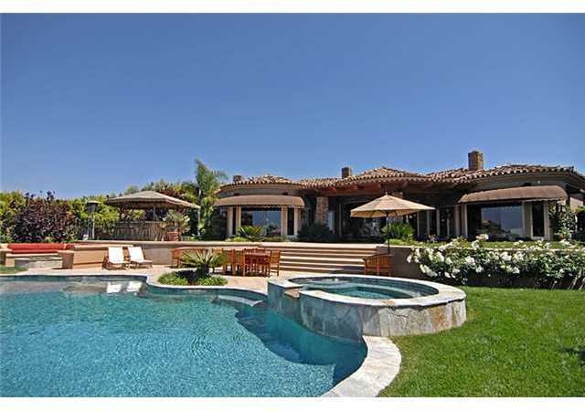 6890 St Andrews Road Rancho Santa Fe, CA 92067 - Photo 14 of 15 A view looking back to the home and Baja Bar from the pool and spa.