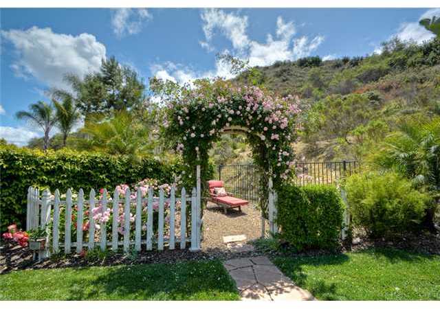 5029 Ashberry Road Carlsbad, CA 92008 - Photo 23 of 25 This Rose covered arch leads into a private garden or relaxing Zen spot