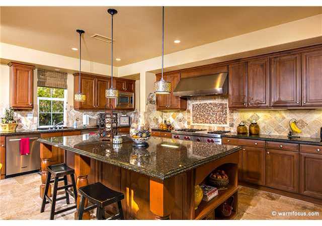 7603 Circulo Sequoia Carlsbad, CA 92009 - Photo 9 of 25 Gourmet Kitchen with large island, stainless steel KitchenAid appliances, granite counter tops, dual dishwasher, beautiful backspalsh