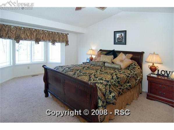 5282 Willowbrook Road Colorado Springs, CO 80917 - Photo 6 of 14 Master bedroom has cathedral ceiling, bay window, and attached bath.