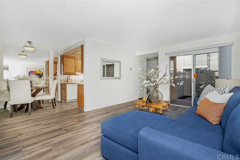7855 Hummingbird Lane San Diego, CA 92123 - Photo 2 of 25 Beautiful and bright living room with 2 patios for exceptional indoor/outdoor living.