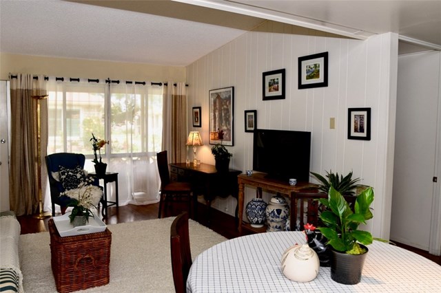 13881 Thunderbird Drive, Unit 64K Seal Beach, CA 90740 - Photo 4 of 21 Front room showing vaulted ceilings and sitting area.