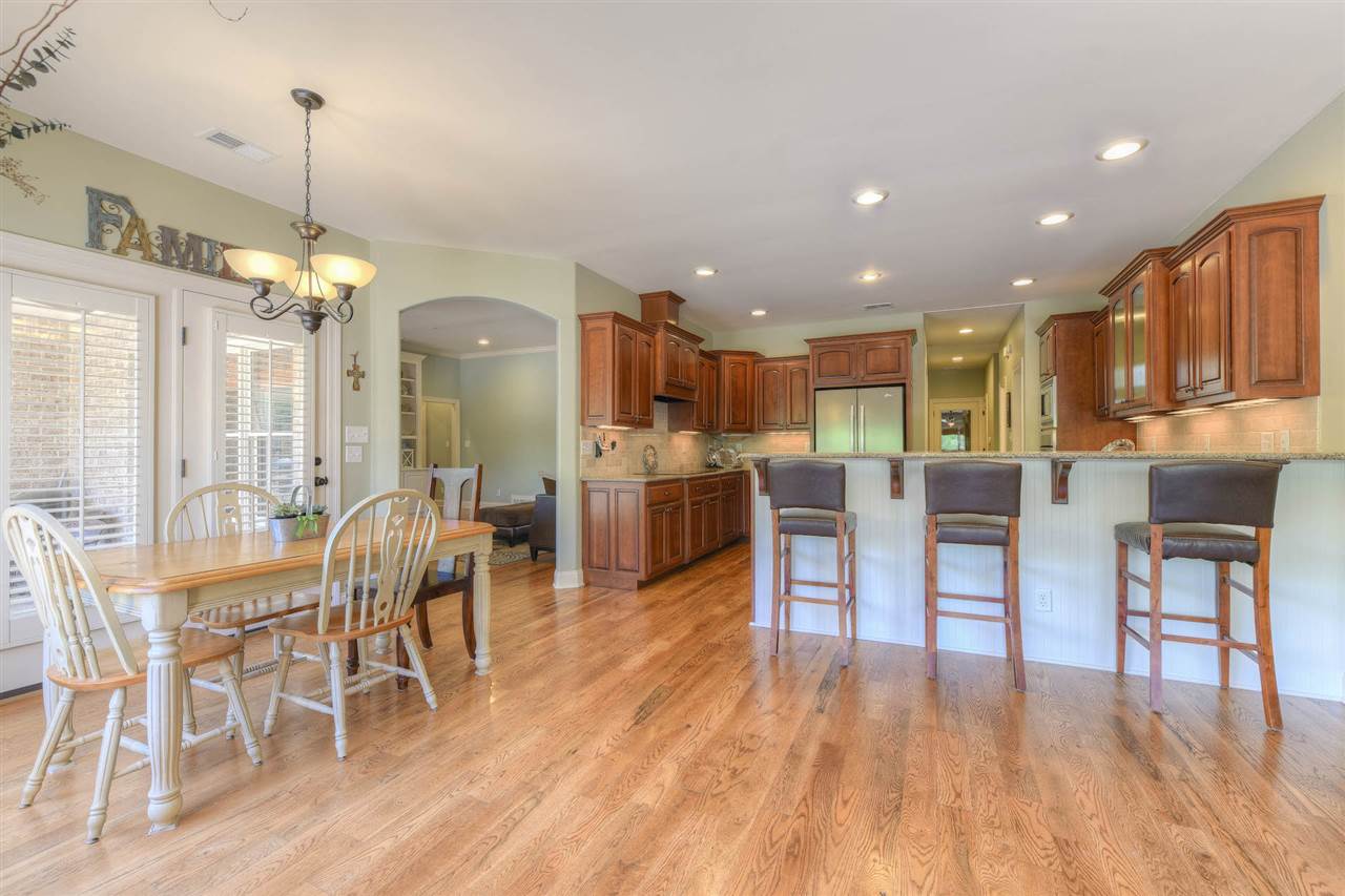 327 Fletcher Road Collierville, TN 38017 - Photo 7 of 25 No doubt your attention will be on the breathtaking outdoor entertaining spaces, but focus your attention on the heart of the home & you wont be disappointed...custom cabinetry, space for everyone to gather, and appliances every chef can appreciate.