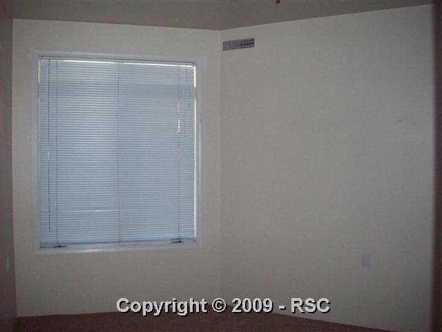 175 West Cheyenne Road, Unit 102 Colorado Springs, CO 80906 - Photo 2 of 11 master bedroom with ceiling fan