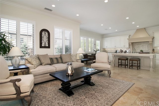 17 Rawhide Irvine, CA 92602 - Photo 8 of 56 Home features extensive crown molding and wood shutters throughout.